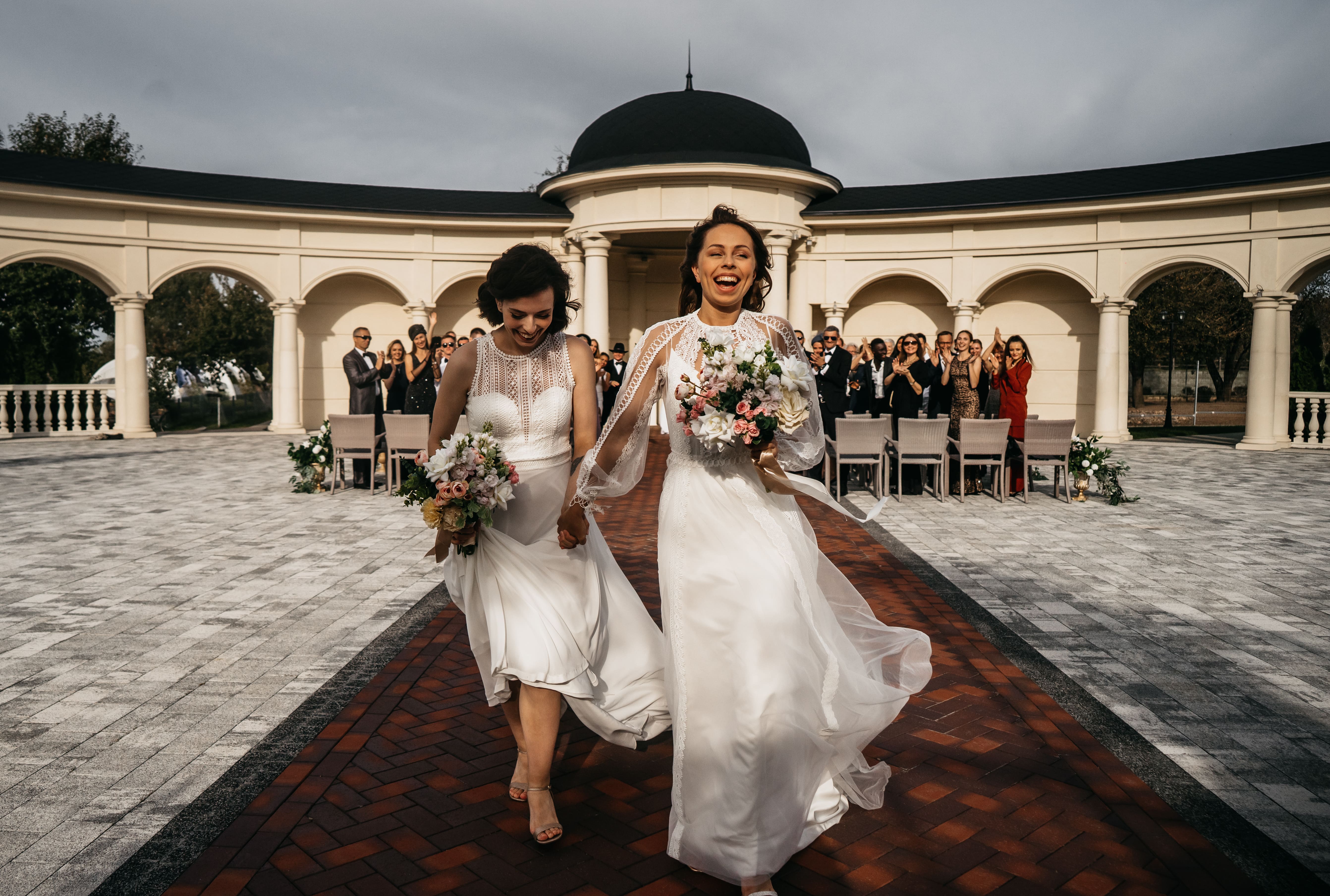 Same-sex wedding couple walking after their ceremony